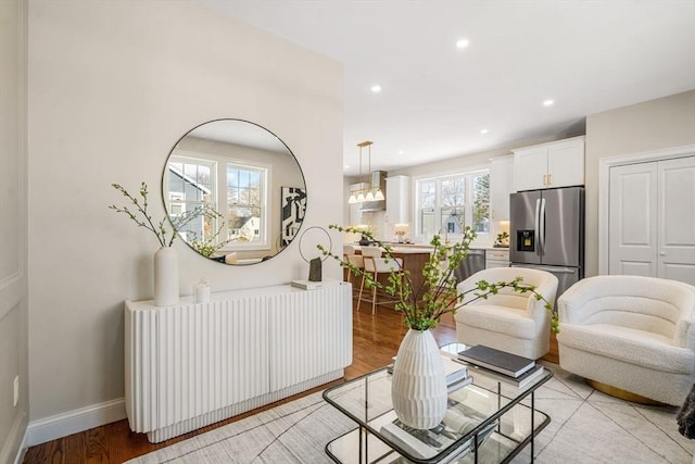 living room featuring radiator and light hardwood / wood-style floors