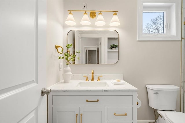 bathroom with vanity and toilet