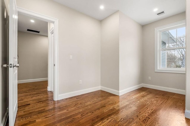 spare room featuring hardwood / wood-style floors