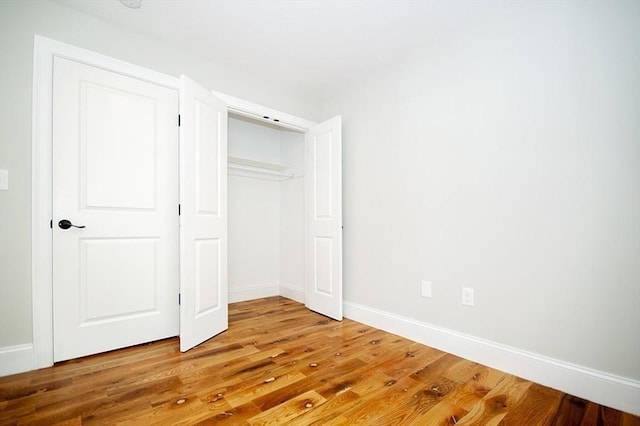 89 Morris St, Boston, MA 02128 - unfurnished bedroom with light wood-style floors and a closet