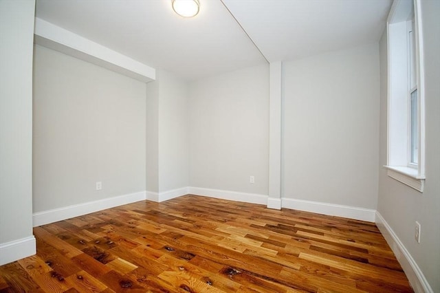 89 Morris St, Boston, MA 02128 - empty room with wood finished floors and baseboards