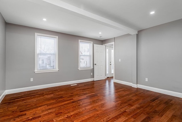 unfurnished room featuring dark hardwood / wood-style floors