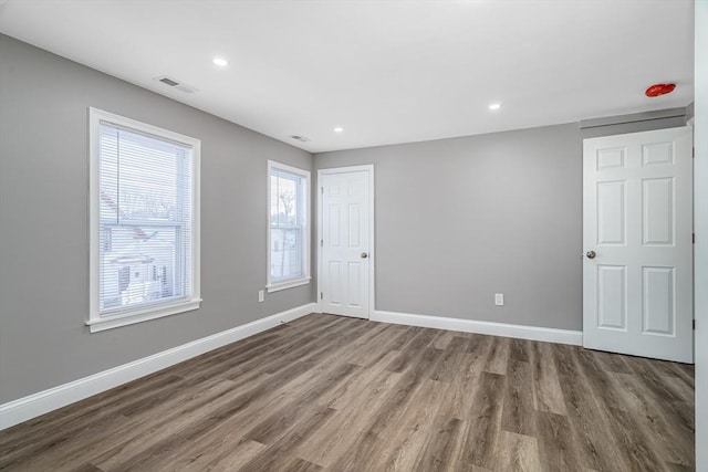 unfurnished room featuring hardwood / wood-style floors