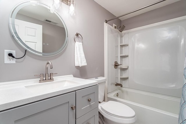 full bathroom with shower / tub combo, vanity, and toilet