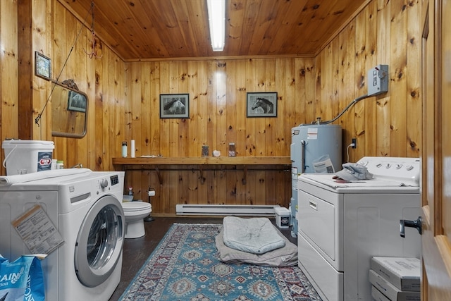 washroom featuring wooden walls, wood ceiling, baseboard heating, and washing machine and dryer