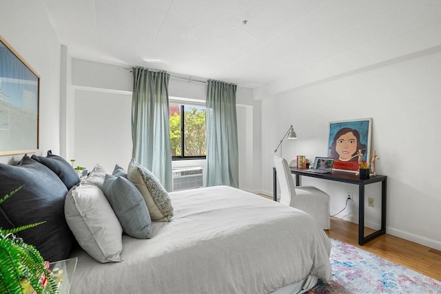 135 Pleasant St Unit 403, Brookline, MA 02446 - bedroom featuring wood finished floors and cooling unit