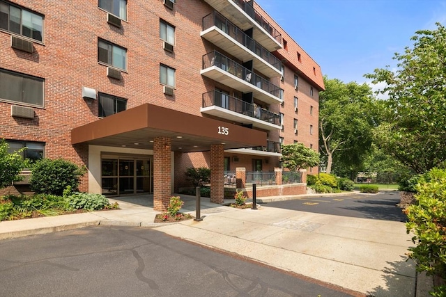 135 Pleasant St Unit 403, Brookline, MA 02446 - view of apartment building / complex featuring cooling unit