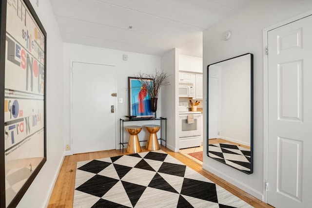 135 Pleasant St Unit 403, Brookline, MA 02446 - hall with light wood-type flooring