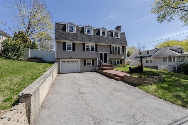 37 Hillcrest Ave, Methuen, MA 01844 - raised ranch with driveway, a chimney, a shingled roof, and an attached garage