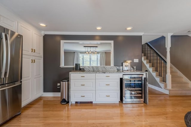 37 Hillcrest Ave, Methuen, MA 01844 - bar area with freestanding refrigerator, beverage cooler, stairway, baseboards, and recessed lighting