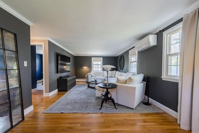 37 Hillcrest Ave, Methuen, MA 01844 - living area featuring wood finished floors, crown molding, a wall mounted air conditioner, baseboards, and a baseboard radiator