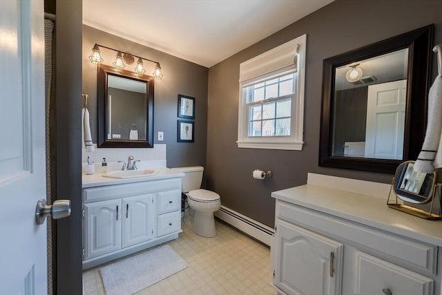 37 Hillcrest Ave, Methuen, MA 01844 - bathroom with a baseboard heating unit, vanity, toilet, and baseboards