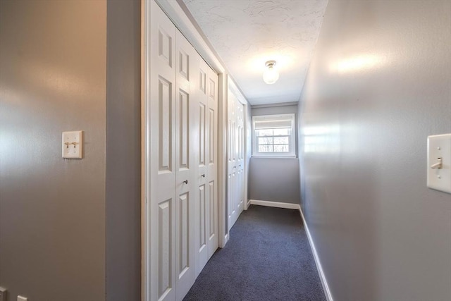 37 Hillcrest Ave, Methuen, MA 01844 - corridor with baseboards and dark carpet