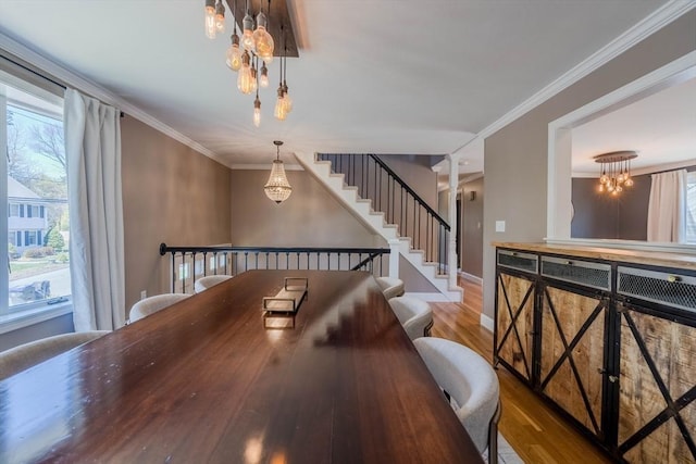 37 Hillcrest Ave, Methuen, MA 01844 - dining area with a chandelier, wood finished floors, crown molding, and baseboards