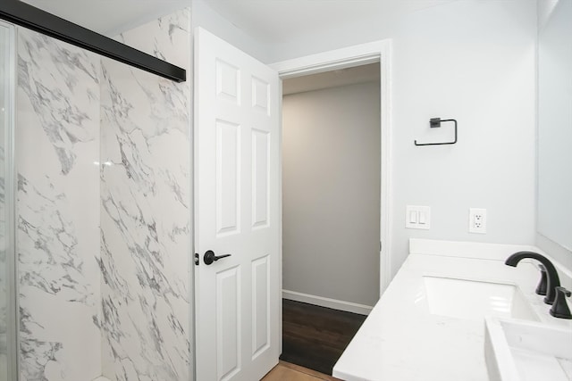 bathroom featuring vanity and hardwood / wood-style floors