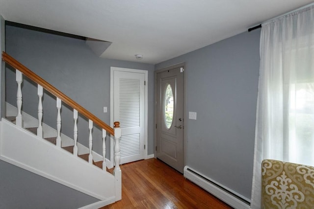 67 Donbray Rd, Springfield, MA 01119 - foyer entrance with baseboard heating, wood finished floors, stairway, and baseboards