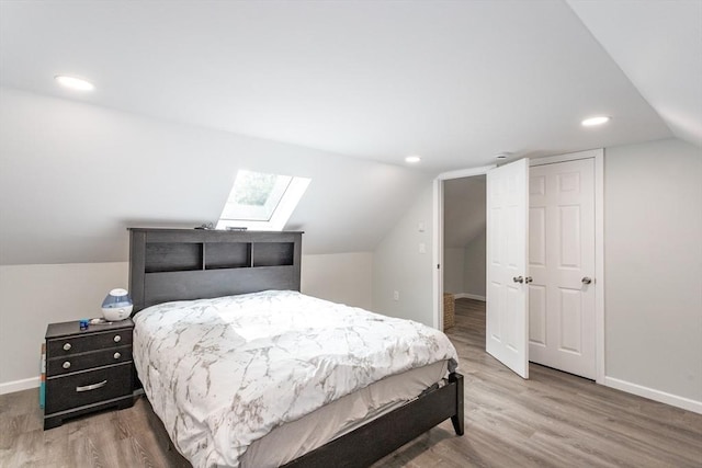 67 Donbray Rd, Springfield, MA 01119 - bedroom with a skylight, baseboards, lofted ceiling, wood finished floors, and recessed lighting