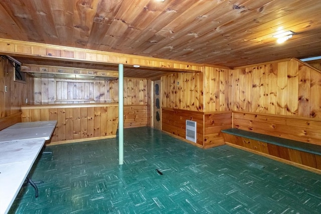 67 Donbray Rd, Springfield, MA 01119 - finished below grade area featuring wood walls, heating unit, baseboards, and wooden ceiling
