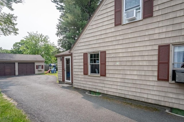 67 Donbray Rd, Springfield, MA 01119 - view of side of home with an outbuilding and a detached garage