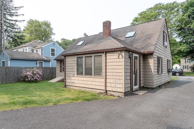 67 Donbray Rd, Springfield, MA 01119 - view of home's exterior with a chimney and a shingled roof