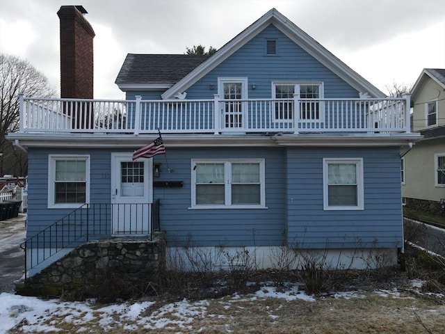 view of front of home with a balcony