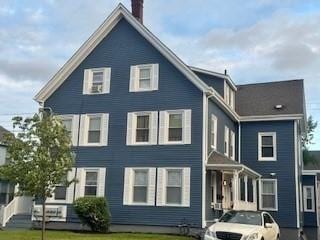 59-61 Waite St, Malden, MA 02148 - back of property featuring a chimney and a yard