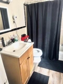 59-61 Waite St, Malden, MA 02148 - full bath with vanity, toilet, and wood finished floors