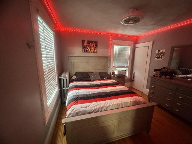 59-61 Waite St, Malden, MA 02148 - bedroom featuring wood finished floors, multiple windows, and baseboards