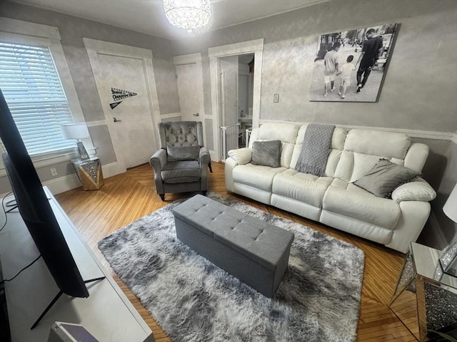 59-61 Waite St, Malden, MA 02148 - living area with a chandelier and baseboards