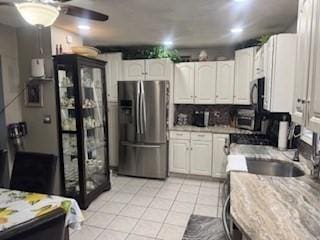 59-61 Waite St, Malden, MA 02148 - kitchen featuring stainless steel refrigerator with ice dispenser, white cabinetry, light tile patterned floors, tasteful backsplash, and a ceiling fan