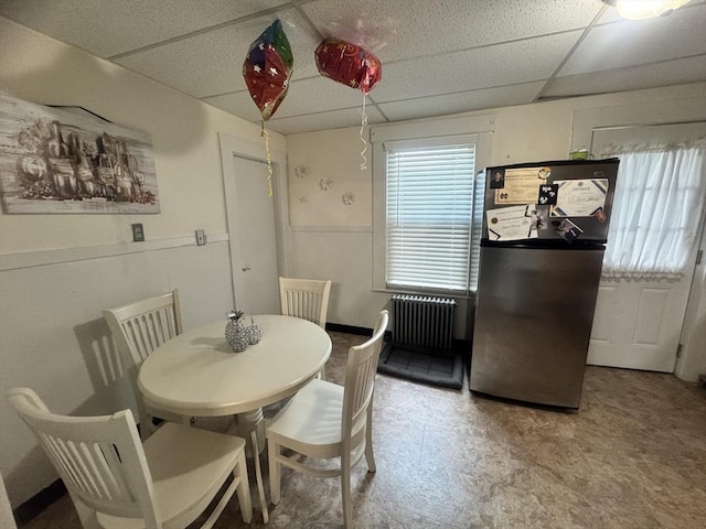 59-61 Waite St, Malden, MA 02148 - dining space featuring radiator heating unit, a paneled ceiling, and tile patterned floors