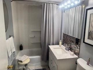 59-61 Waite St, Malden, MA 02148 - bathroom with toilet, shower / bathtub combination with curtain, and vanity