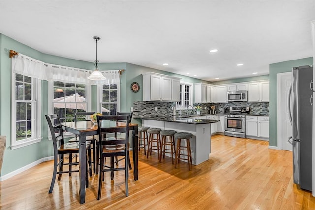 4 Kattail Rd, Hudson, MA 01749 - dining room featuring light wood finished floors and recessed lighting