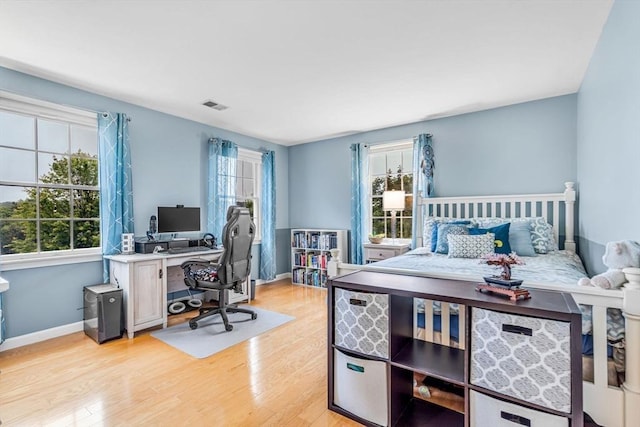 4 Kattail Rd, Hudson, MA 01749 - bedroom with a desk and light wood-type flooring