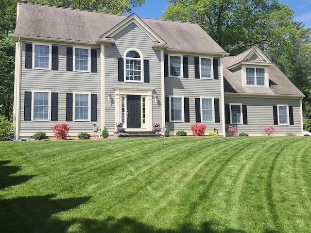 4 Kattail Rd, Hudson, MA 01749 - colonial inspired home featuring a front yard and a shingled roof