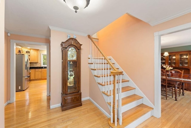 16 Preserve Way, Sturbridge, MA 01566 - stairway with wood-type flooring, ornamental molding, and baseboards