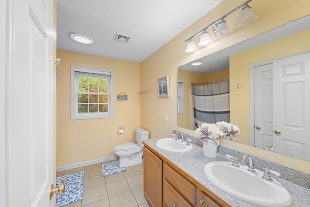 16 Preserve Way, Sturbridge, MA 01566 - bathroom featuring toilet, double vanity, tile patterned floors, baseboards, and a shower with curtain