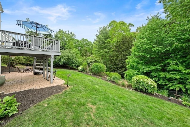 16 Preserve Way, Sturbridge, MA 01566 - view of green lawn with stairway, a patio, and a deck