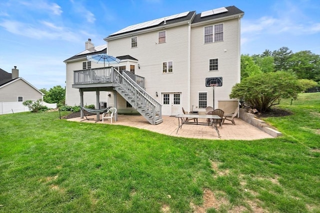 16 Preserve Way, Sturbridge, MA 01566 - rear view of property with a patio area, stairs, a deck, a lawn, and roof mounted solar panels
