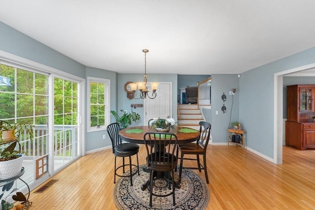 16 Preserve Way, Sturbridge, MA 01566 - dining room featuring stairway, light wood finished floors, baseboards, and a chandelier