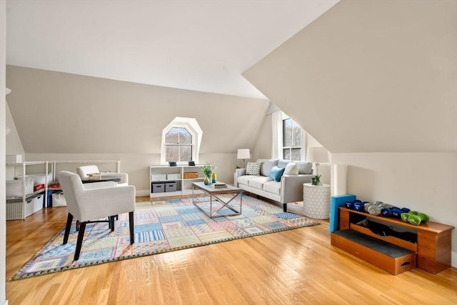 living room with lofted ceiling and wood finished floors