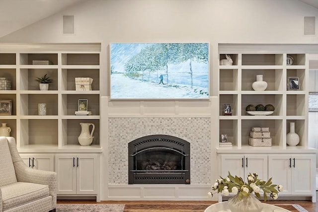 22 High St, Southborough, MA 01772 - living area featuring wood finished floors, a tile fireplace, and vaulted ceiling