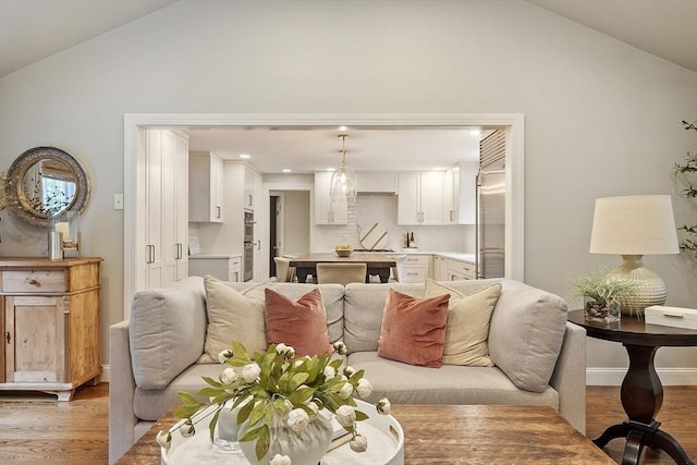 22 High St, Southborough, MA 01772 - living area featuring light wood-type flooring, high vaulted ceiling, and recessed lighting