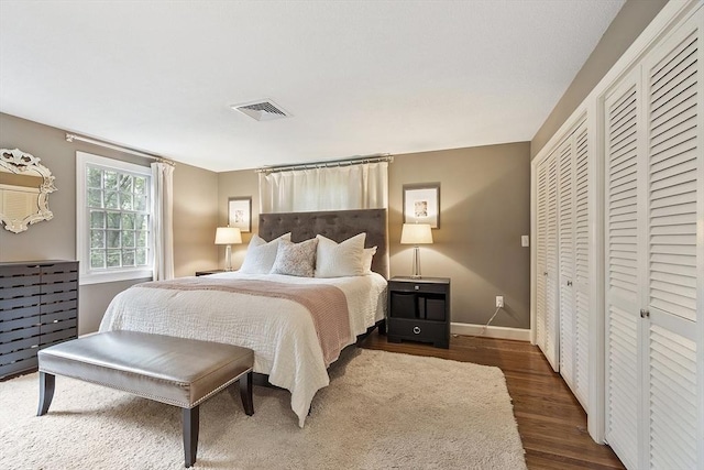 22 High St, Southborough, MA 01772 - bedroom featuring wood finished floors and two closets