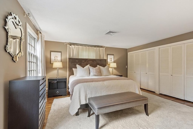 22 High St, Southborough, MA 01772 - bedroom featuring two closets and wood finished floors