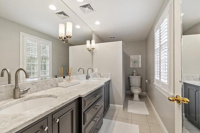 22 High St, Southborough, MA 01772 - bathroom featuring double vanity, tile patterned floors, and recessed lighting