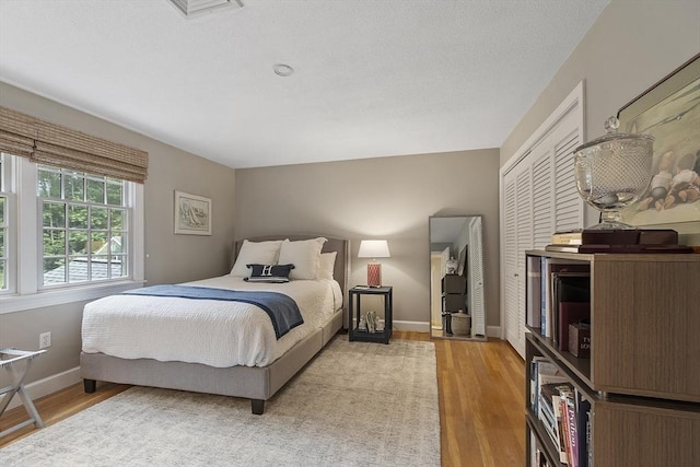 22 High St, Southborough, MA 01772 - bedroom with light wood-style flooring and a closet