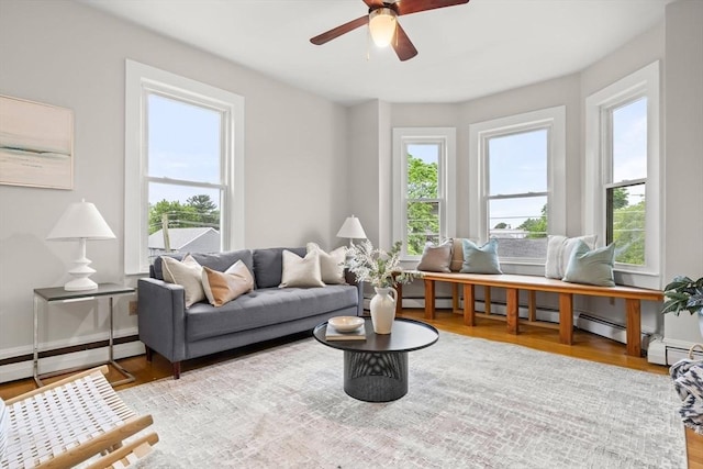 464 Windsor St Unit 3, Cambridge, MA 02141 - living room featuring wood finished floors, ceiling fan, and a baseboard radiator