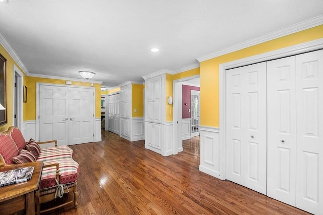 38 Lincoln Cir E, Andover, MA 01810 - living area featuring wood finished floors, ornamental molding, wainscoting, and a decorative wall