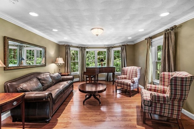 38 Lincoln Cir E, Andover, MA 01810 - living room with healthy amount of natural light, crown molding, wood finished floors, and recessed lighting